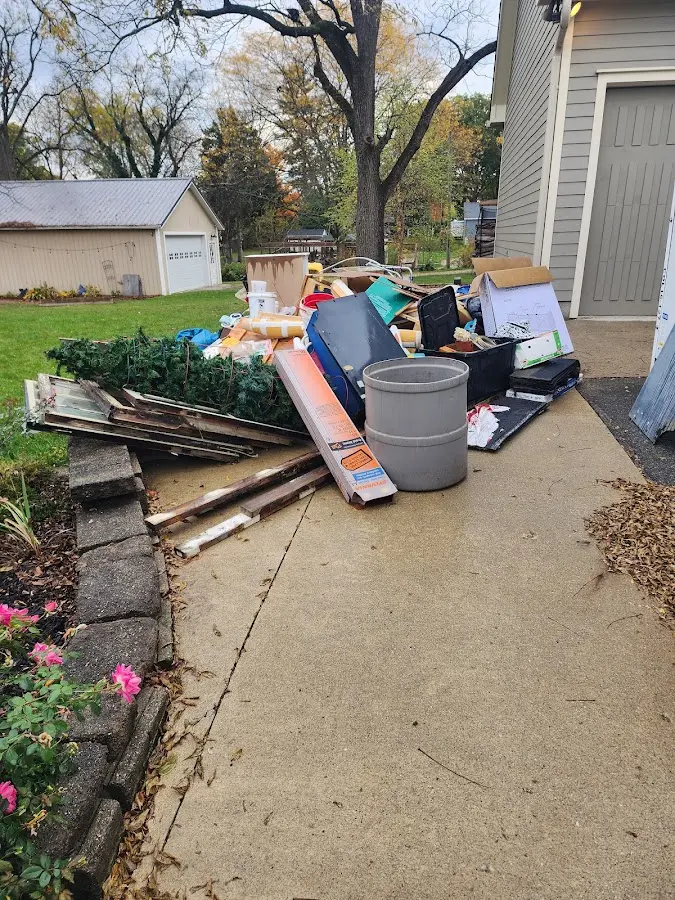 Dumpster being loaded with debris for Commercial Dumpster Rental in Val Verde